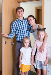 Fototapeta na wymiar Family at doorway of rented property .