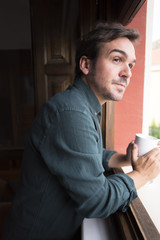 Relaxed man drinking a cup of coffee