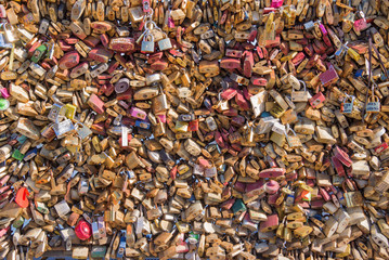Background of many love lockers on a bridge in Paris, France