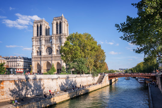 Fototapeta Facade of Notre Dame de Paris and the river Seine, Paris, France