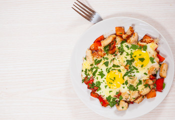 fried eggs with chicken breast, pepper and cheese