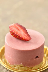 Raspberry white chocolate on gold plate strawberry on top