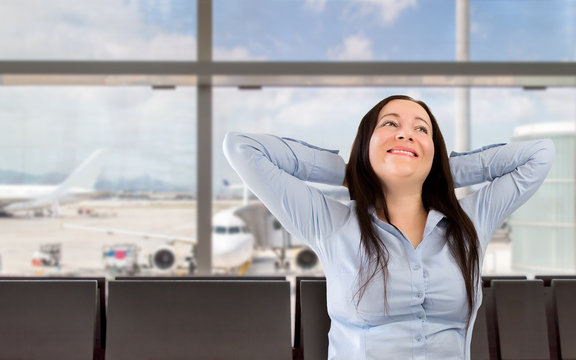woman smiling at the lobby of the airport