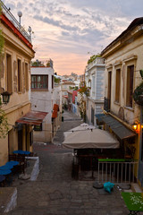Morning street with coffee shops before opening. Image from the old town of Athens