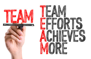 Hand with marker writing: Team