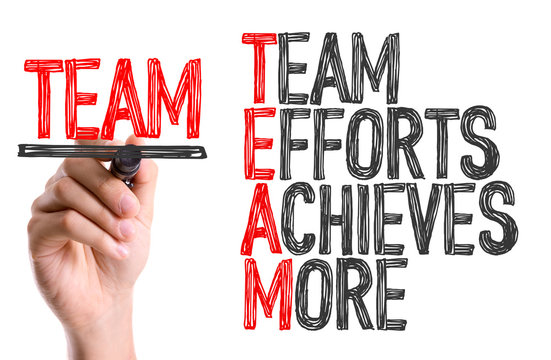 Hand with marker writing: Team