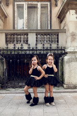 Two little ballerinas dansing in black tutu