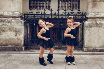 Two little ballerinas dansing in black tutu