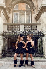 Two little ballerinas dansing in black tutu