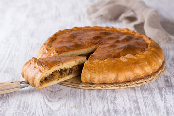 Vegetable pie on a wooden surface, selective focus