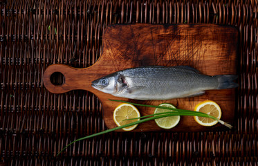  There is fresh fish on a wooden board