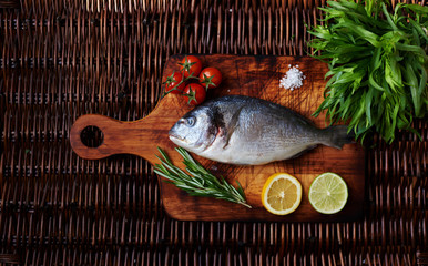  There is fresh fish on a wooden board