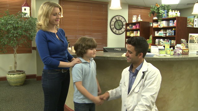 Doctor says bye to young patient