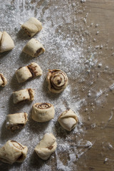 ingredients of roses pastry on a table with flour