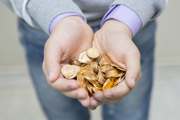 Handful of coins in palm hands