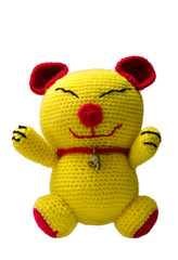 handmade crochet yellow cat doll on white background