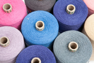 Sewing threads as a color background close up
