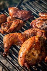 Chicken cooking on an open fire