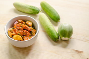 Pickled mussels spicy salad with cucumber and thai Eggplant