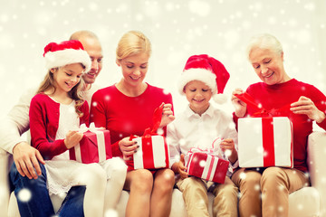 smiling family with gifts at home