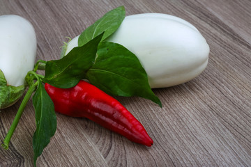 Ripe white eggplant and red hot pepper