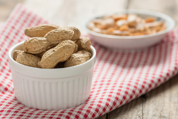 Peanut in white bowl.
