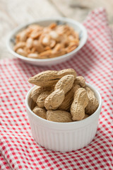 Peanut in white bowl.
