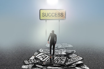 businessman walking  on problems to success on traffic sign, success concept