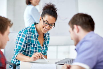 Fototapeta premium group of happy high school students with workbook