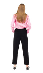 Fototapeta premium back view of standing young beautiful woman.