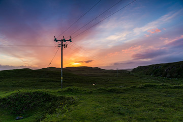 Telephone or electricity line in the fields at sunset - 92449541