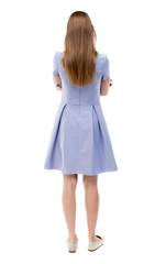 back view of standing young beautiful  woman.