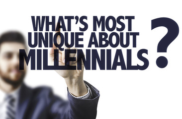 Business man pointing the text: Whats Most Unique About Millennials?