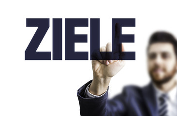 Business man pointing the text: Goals (in German)