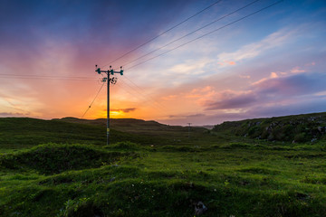 Telephone or electricity line in the fields at sunset - 92450702