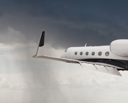 Close Up Of A Private Jet Flying In A Storm