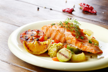 Fried salmon fillet with vegetables