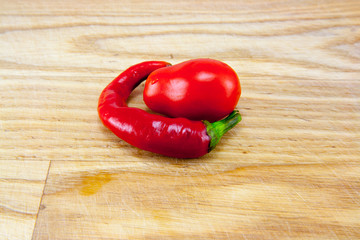 Red chili peppers on chopping board