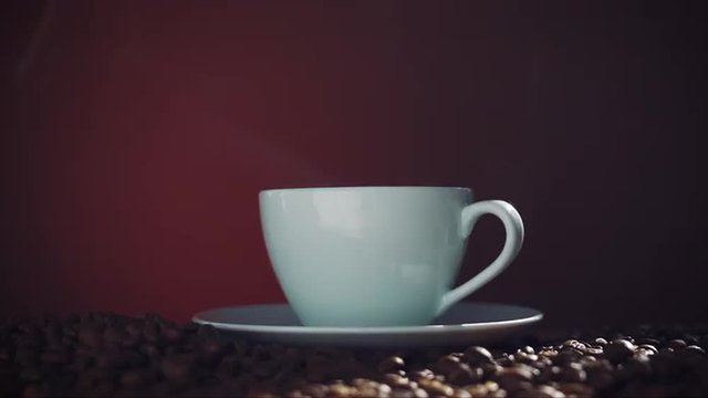 steaming coffee with beans 
