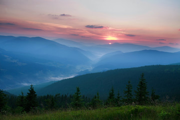 Naklejka na ściany i meble Dawn sun rise early in the morning in a mountain valley