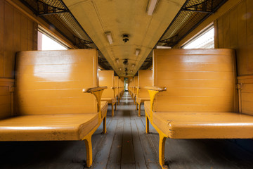 Empty wooden seats and interior of old train