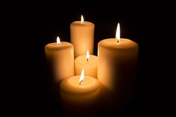Fototapeta na wymiar five Candles on black background