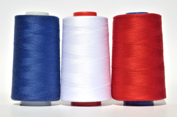 Blue, white and red thread