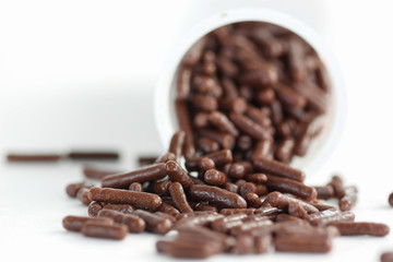 Chocolate sprinkles on a white background 