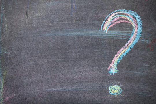 Colorful chalk question mark on blackboard background - Powered by Adobe