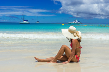 Fototapeta na wymiar Girl at Anse Lazio - Paradise beach in Seychelles, tropical island Praslin