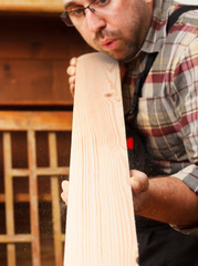 Close up of a young carpenter at work.