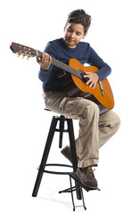 Child Playing Guitar on Chair