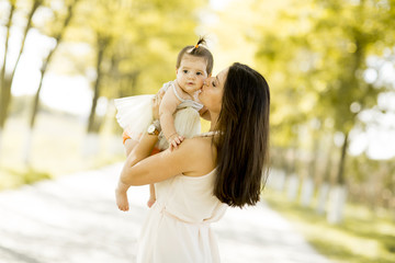 Mother and baby in the summer park