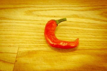 Red chili peppers on chopping board